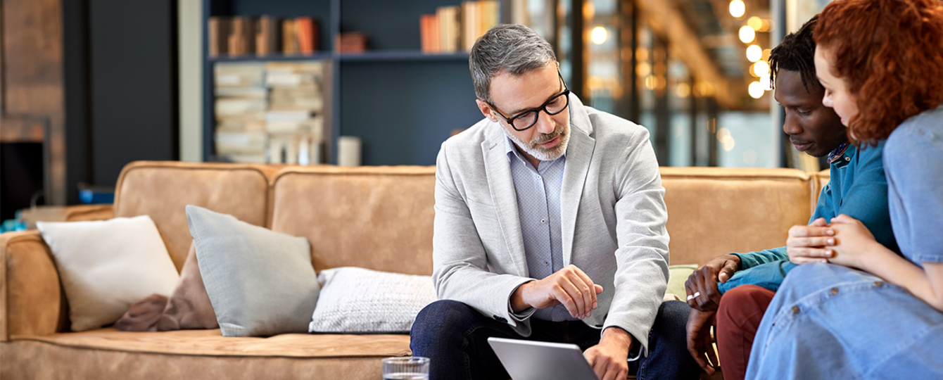A young male talking to his Merrill financial advisor
